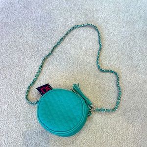 Turquoise crossbody bag with lots of room inside and NWT